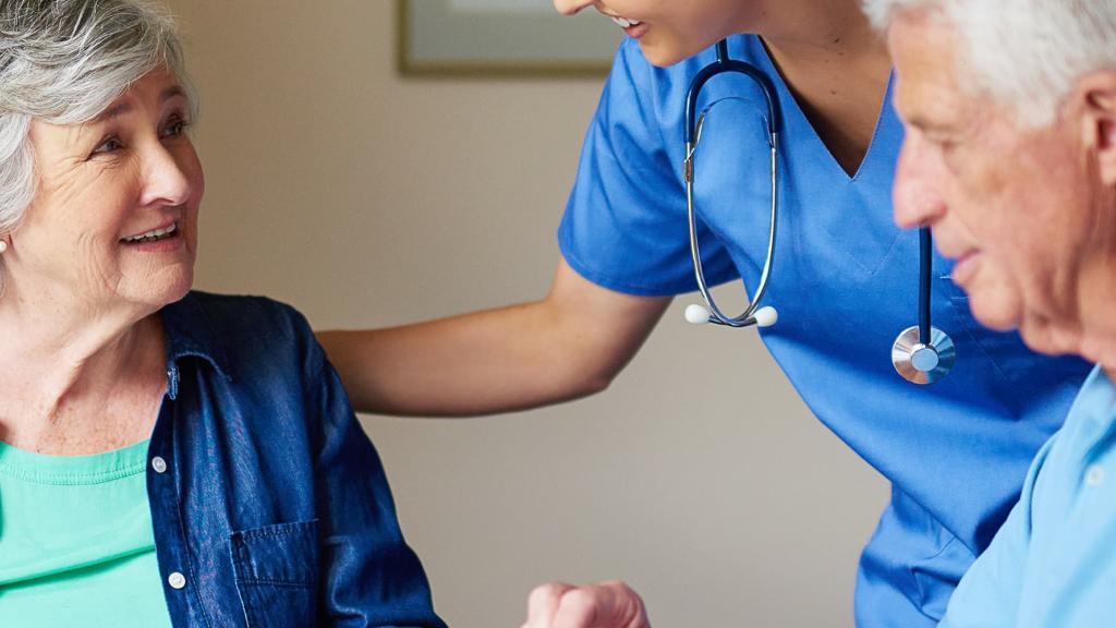 Older couple with nurse