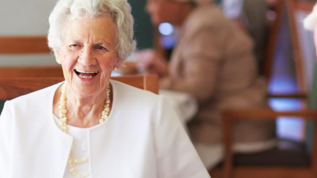 Smiling grandma in dining room